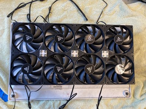 2015 Ford F-550 - A set of eight computer case fans are laid out on a surface, connected by wires.