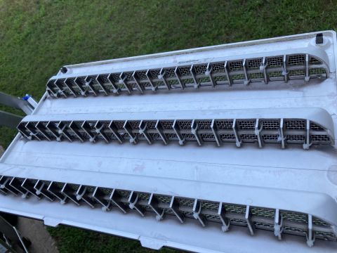 2015 Ford F-550 - Three rows of grey fridge vent fans with metal mesh are shown, likely for a recreational vehicle.