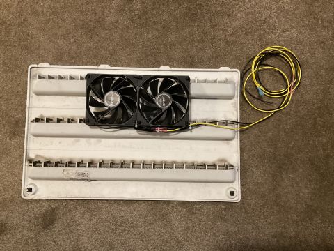 2015 Ford F-550 - Two computer fans mounted on a white plastic panel with wiring.