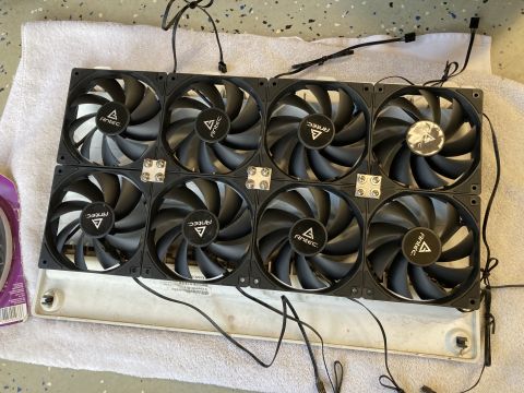 2015 Ford F-550 - A collection of eight Antec computer fans are laid out on a white towel, connected by black wires.