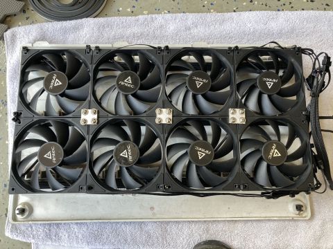 2015 Ford F-550 - Eight Antec computer case fans are mounted on a metal frame, with wiring visible.
