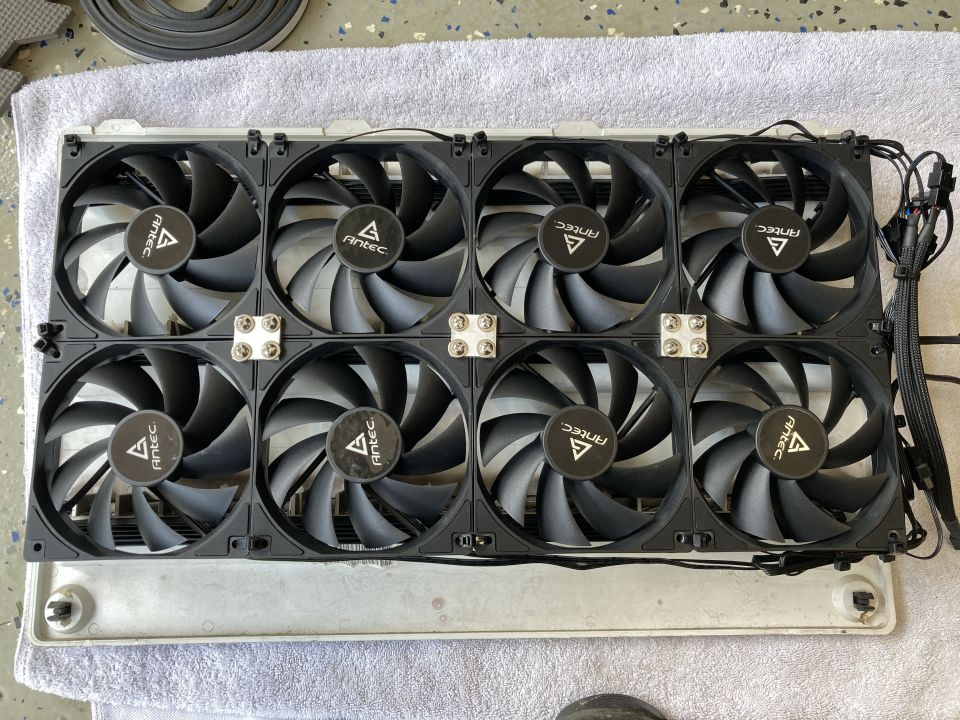 Eight Antec computer case fans mounted on a metal frame