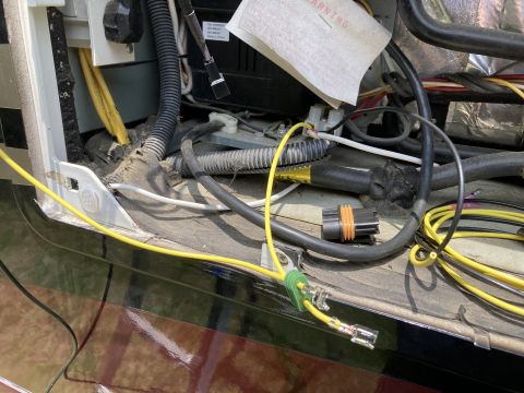 2015 Ford F-550 - This image shows a close-up view of various wiring and electrical components, likely from a vehicle's engine bay or undercarriage.