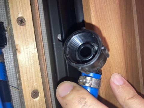 2015 Ford F-550 - Plumbing fitting detail with blue pipe and clamp. Text on clamp is partially visible.