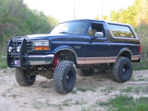 1995 Ford Bronco - This lifted 1995 Ford Bronco features a brush guard and large off-road tires.