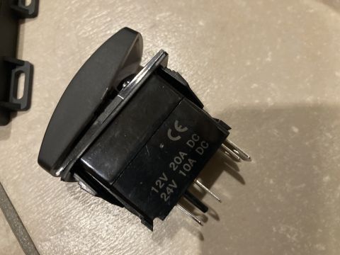 2015 Ford F-550 - A rocker switch with markings for 12V 20A DC and 24V 10A DC is shown.
