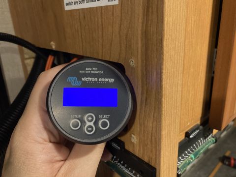 2015 Ford F-550 - A Victron BMV-702 battery monitor is shown, with its blue display active.