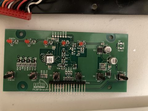 2015 Ford F-550 - A close-up view of a KIB Electronics circuit board, identified as PCBF8revA-B, with various labeled buttons and indicator lights.