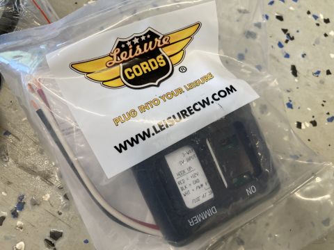 2015 Ford F-550 - A dimmer module with wiring is shown inside its packaging, branded by Leisure Cords.