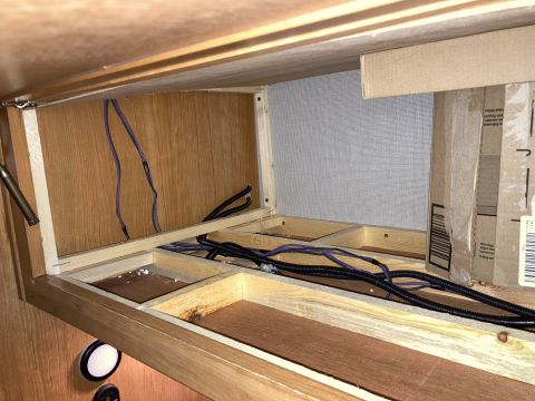 2015 Ford F-550 - Unfinished wooden compartments with exposed wiring are visible in this interior shot.