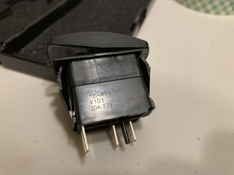 2015 Ford F-550 - A close-up view of a Carling Technologies V1D1 20A 12V switch, showing its model number and electrical rating.