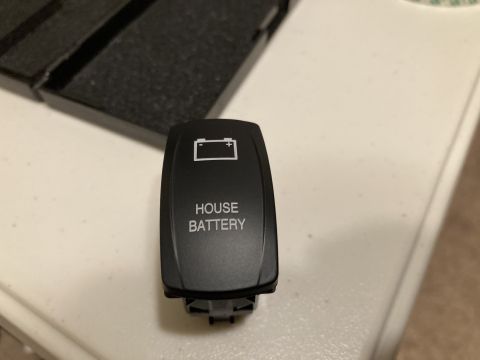2015 Ford F-550 - A close-up of a toggle switch labeled 'HOUSE BATTERY' with a battery icon.