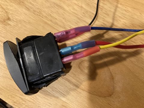 2015 Ford F-550 - Close-up of a rocker switch with connected wires, showing wire gauge markings.