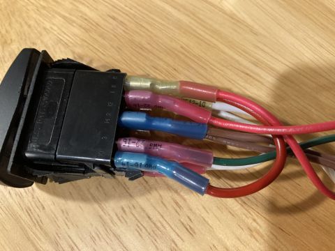 2015 Ford F-550 - Close-up of an electrical switch and its connected wiring harness, showing various colored wires and connectors.