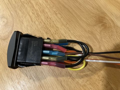 2015 Ford F-550 - A Carling Technologies VLD2 switch with multiple wires attached is shown on a wooden surface.