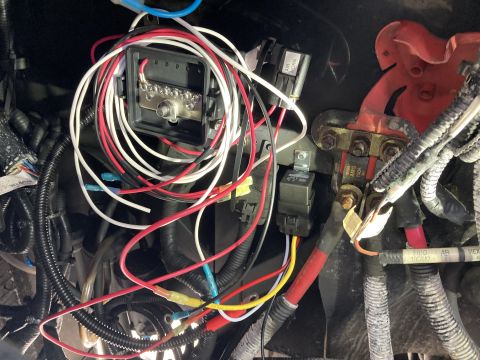 2015 Ford F-550 - Vehicle electrical system with multiple wires, a fuse box, and relays visible.