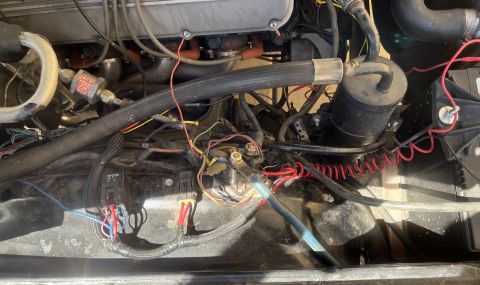 1975 Ford Ranchero - Close-up view of a vehicle's engine bay, showing complex wiring and components.