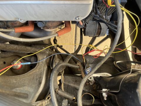 1975 Ford Ranchero - This image shows a close-up view of the engine bay, focusing on the wiring and spark plug components.