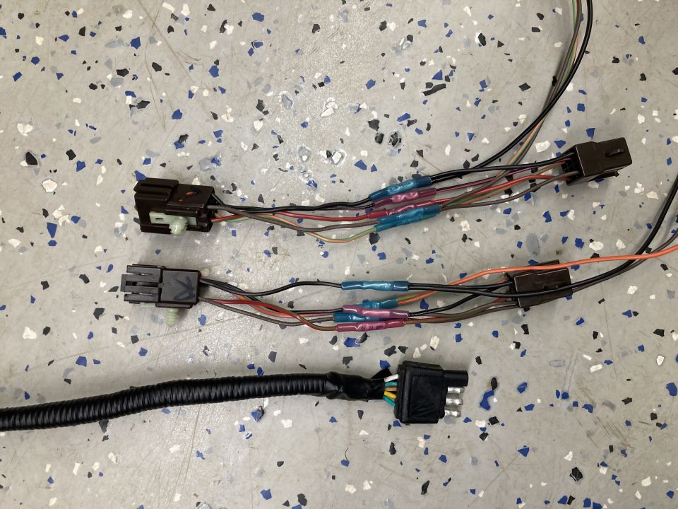 Automotive wiring harness with multiple connectors and heat-shrink tubing