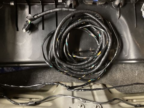 2015 Ford F-550 - A coiled towed harness is visible inside the vehicle's interior, with wiring extending out.