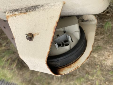 2015 Ford F-550 - Close-up of a vehicle's taillight housing, showing rust and a rubber seal.