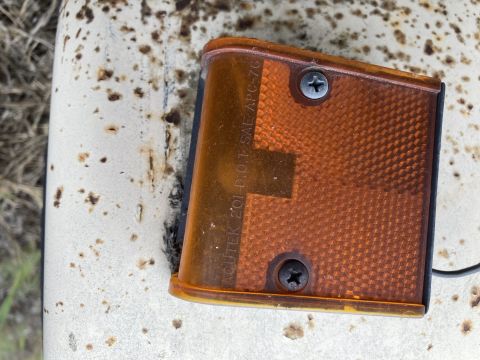 2015 Ford F-550 - Close-up of an amber marker light, showing text indicating 'ACUTEK 201 DOT SAE APC-76'.