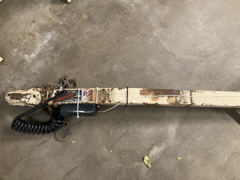 2015 Ford F-550 - A close-up view of a trailer tongue assembly, showing its chains, wiring harness, and a junction box.
