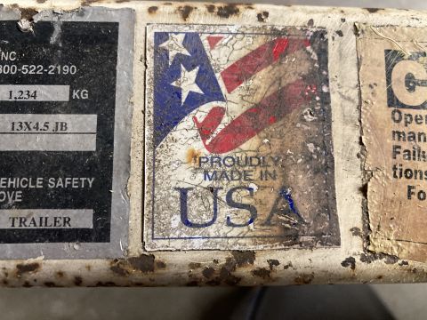 2015 Ford F-550 - A close-up of a trailer's identification plate, a "Proudly Made in USA" sticker and other regulatory information.