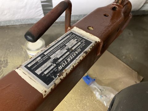 2015 Ford F-550 - A close-up view of a trailer hitch with a weathered data plate.