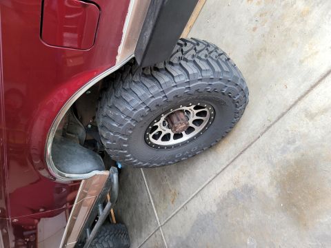 1996 Ford Bronco - Close-up of the rear wheel and fender flare on a 1996 Ford Bronco.