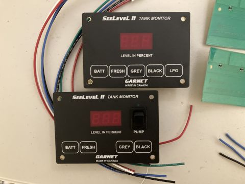 2015 Ford F-550 - Two Garnet SeeLevel II Tank Monitor gauges are shown, one with a pump switch, connected to various colored wires.