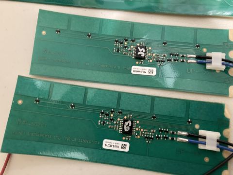 2015 Ford F-550 - Close-up of two electronic circuit boards with visible wiring and integrated circuits.