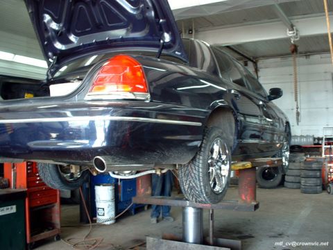 2000 Ford Crown Victoria - Getting the new wheels & tires on. Spring 2003.