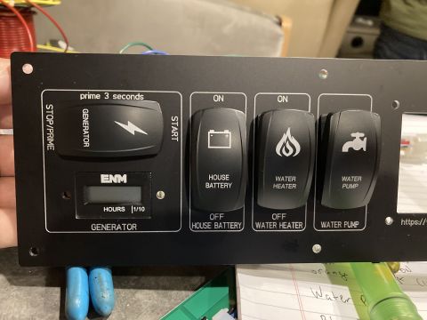 2015 Ford F-550 - Control panel features switches for generator, house battery, water heater, and water pump with an hour meter.