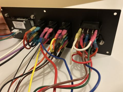 2015 Ford F-550 - Close-up of a switch panel with numerous wires and connectors, likely for custom vehicle electronics.