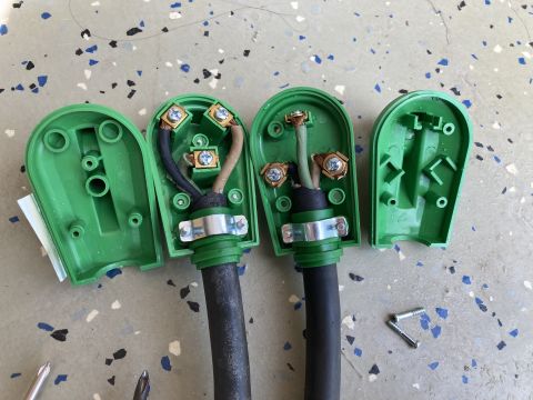 2015 Ford F-550 - Disassembled green electrical plugs reveal internal wiring and screw terminals.