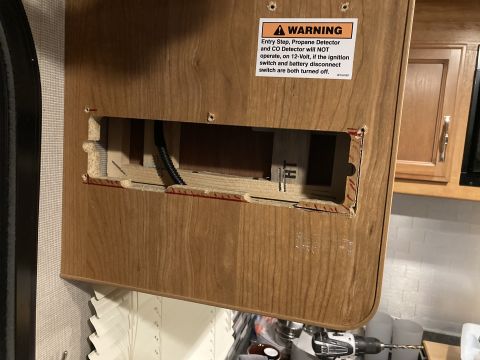 2015 Ford F-550 - Warning label on an RV interior panel indicates detectors require 12-volt power.