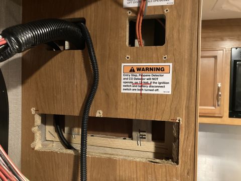 2015 Ford F-550 - A warning label is affixed to an interior panel showing wiring and conduit.