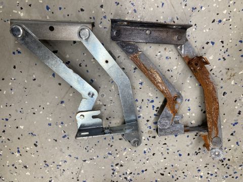 2015 Ford F-550 - Comparison of a new galvanized hood hinge next to an old, rusted one.