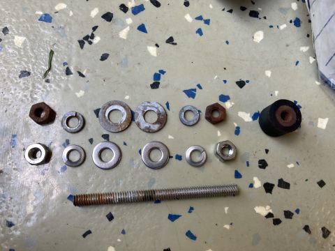 2015 Ford F-550 - Collection of assorted hardware including nuts, washers, a threaded bolt, and a rubber bumper.