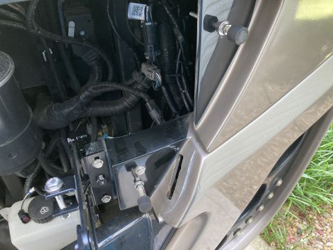 2015 Ford F-550 - This image shows a section of a vehicle's engine bay, focusing on wiring harnesses and mounting brackets.