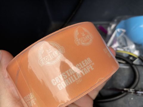 2015 Ford F-550 - A hand holds a roll of clear Gorilla tape, showing the product's branding and text.