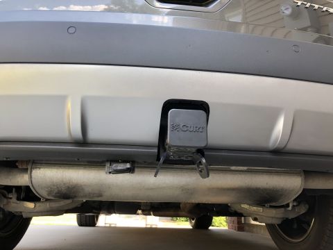 2019 Ford Everest - Close-up of a vehicle's rear underside, focusing on the tow hitch receiver and exhaust system.