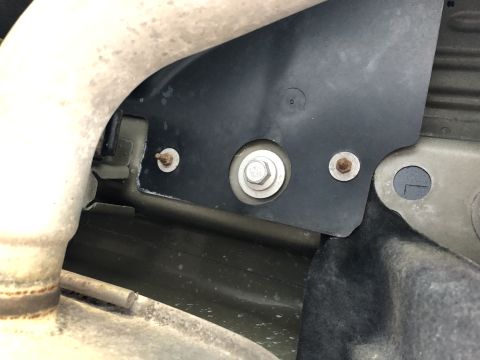 2019 Ford Everest - Detail shot of a vehicle's undercarriage, focusing on the exhaust system and a mounting bracket.