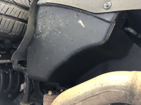 2019 Ford Everest - Close-up view of the undercarriage, showing plastic shielding and suspension parts.