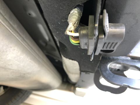 2019 Ford Everest - Close-up view of a trailer hitch wiring connector and its associated wiring harness.