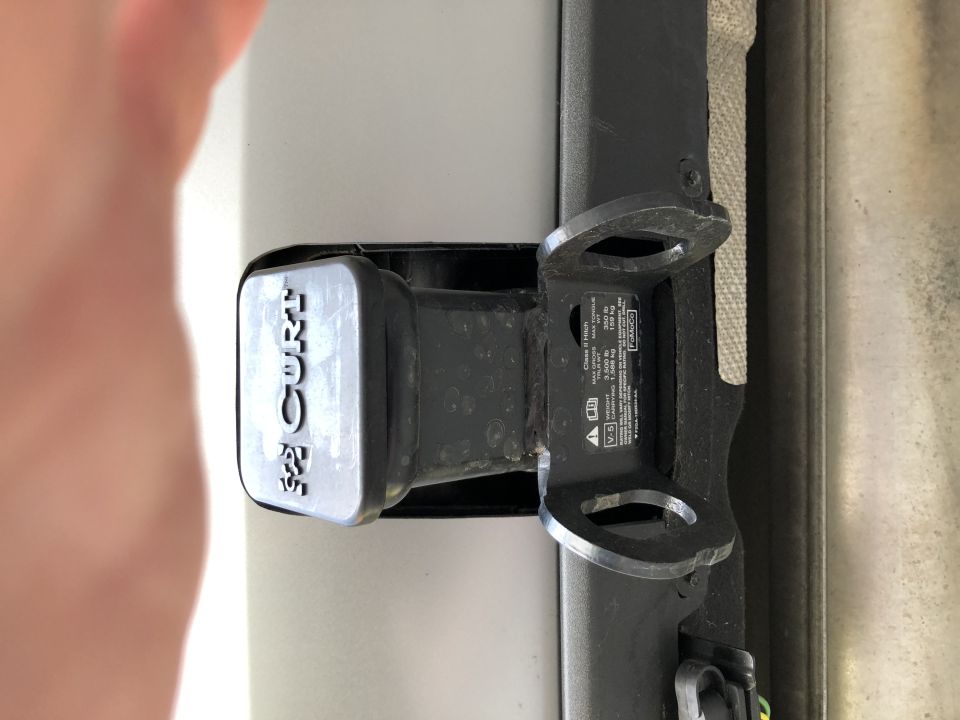 Tow receiver hitch with CURT branding and load rating sticker