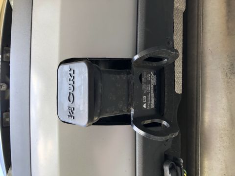 2019 Ford Everest - Close-up of a CURT brand tow hitch receiver and cover, showing mounting bracket details.