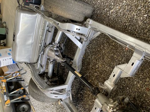 1976 Chevrolet Corvette - Underside view of a Chevrolet Corvette chassis, showing the fuel tank and drivetrain components.