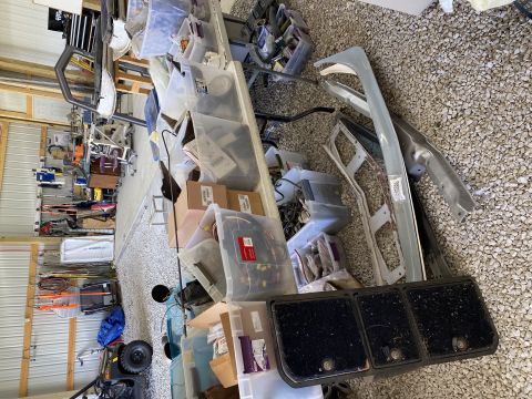 Car parts and storage bins in a garage
